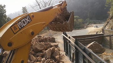 jcb 3dx super rock loading into a truck