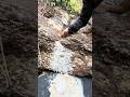 white stone hole filled with white sand mixed with gold dust