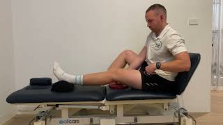 Seated Knee Extension Hang With Overpressure Physio Exercise For Knee Extension Rehab