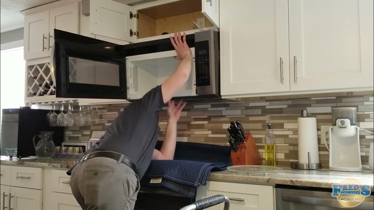 Removing and installing an overtherange microwave with one technician