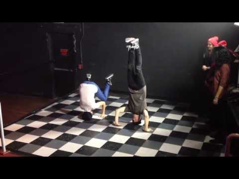 Mishell Livio and David Boyd of New Politics do headstands