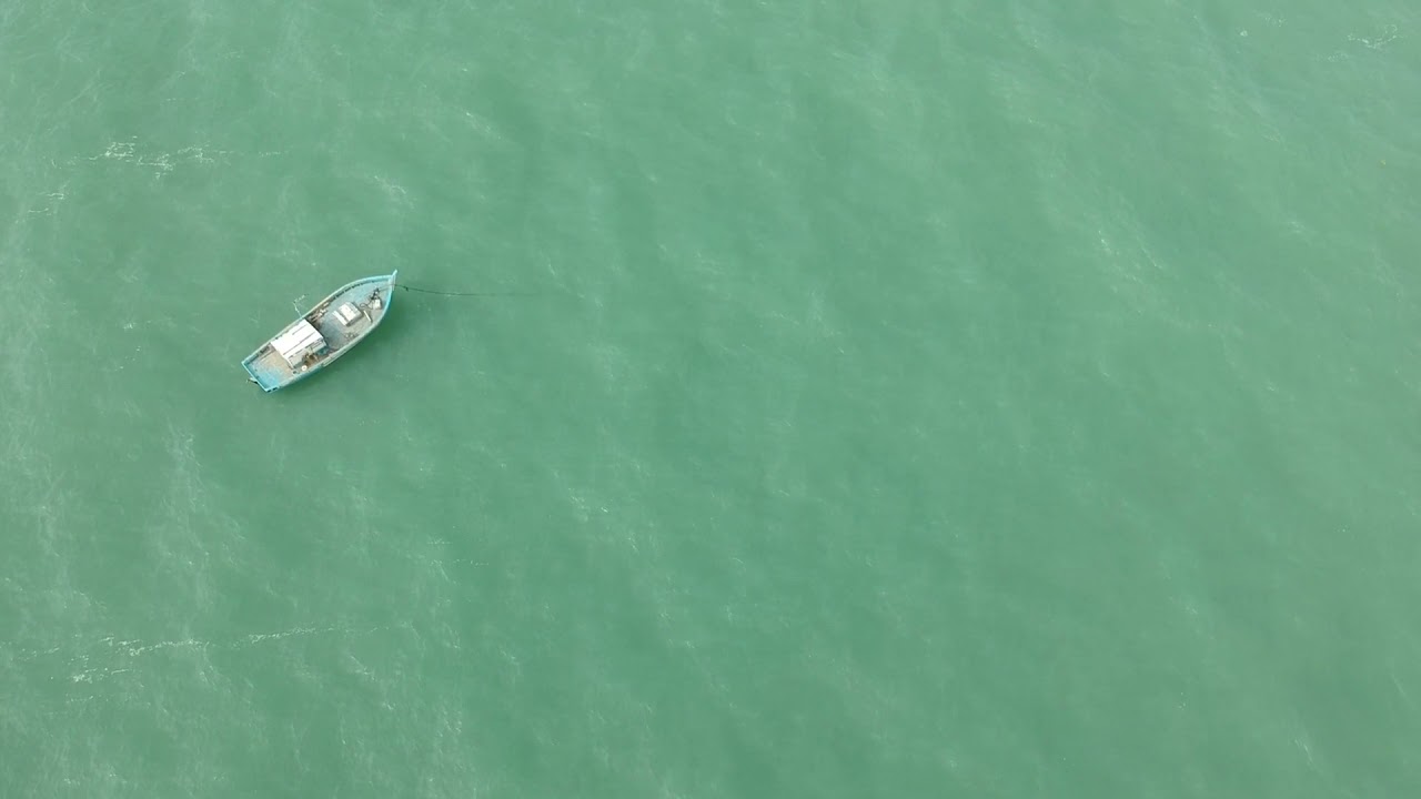 Aerial View Of An Empty Boat In The Sea | Royalty Free 4K Stock Video Footage