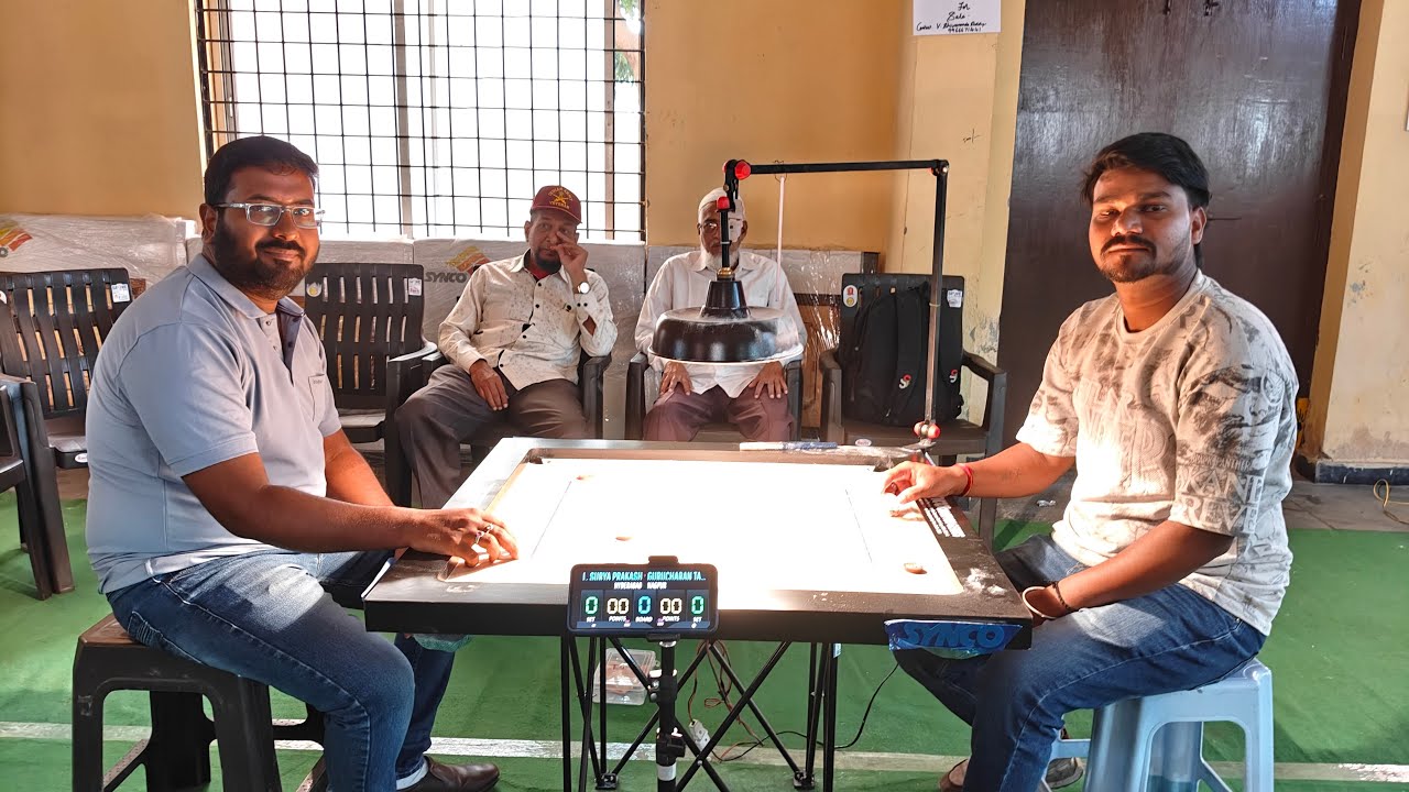 GURU CHARAN TAMBE V'S L.SURYA PRAKASH QUEATER FINAL MATCH CARROM COINS STARS is live!