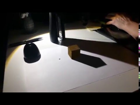 Adobe After Effects:  Camera tracking w/ cube overlay onto real footage