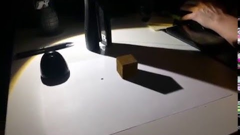 Adobe After Effects:  Camera tracking w/ cube overlay onto real footage