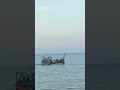 This boat is coming up from the river with Hilsa fish.