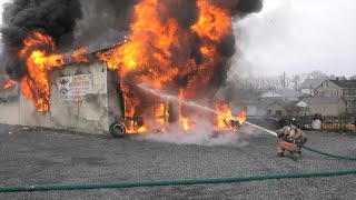 PRE-ARRIVAL: Firefighters battle fire in auto repair shop, North Whitehall, PA.