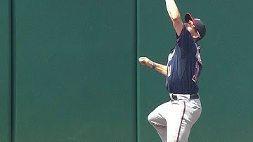 Thomas leaps to make the catch at the wall