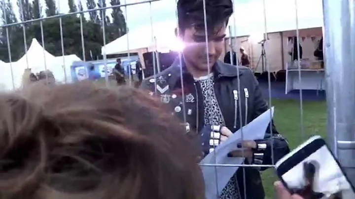 Adam Lambert signs paintings by Robyn Garside for ...