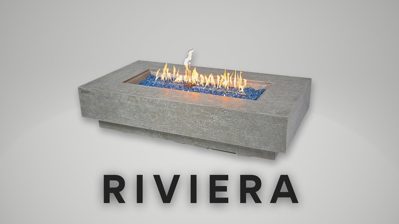 RIVIERA table with a lit fire pit