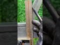 Worker marks frame carefully showing precise alignment method