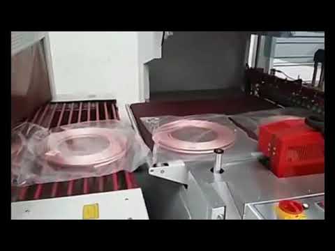 Copper tube coil packing machine and shrinking machine