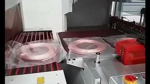 Copper tube coil packing machine and shrinking machine