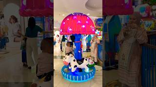 This might be the cutest carousel ever! Pink mushrooms, happy horses, cows, cars, and flowers 🐴🐮🚗