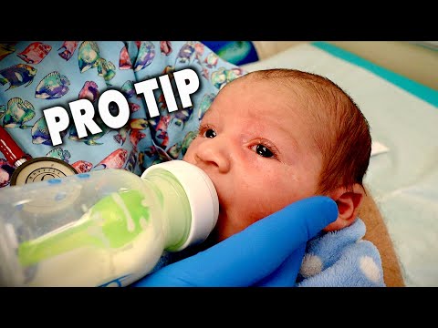 Video: How To Hold A Bottle While Feeding