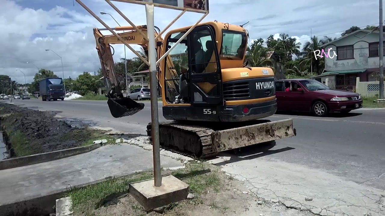 Lumber yard in Goed Fortuin W.B.D Guyana / Dragline cleaning drain