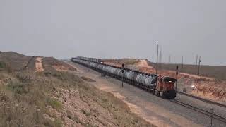 BNSF CLOVIS SUB RICARDO - TANK TRAIN WITH CSX/NS POWER CLIMBING OUT OF PECOS RIVER VALLEY