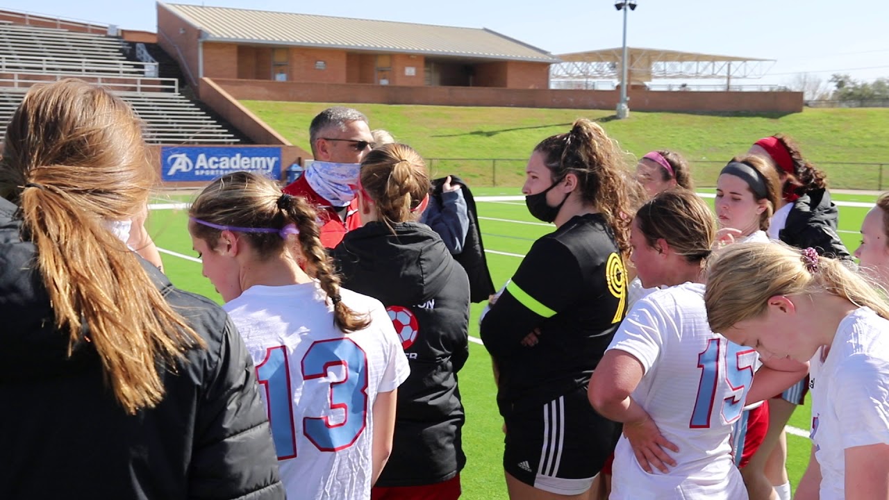 Coach Hobson talks with Lumberton Girls Soccer team after winning the