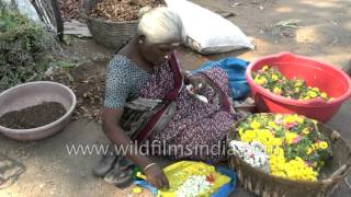 Old South Indian woman makes garland in Madurai Old South Indian woman makes garland in Madurai