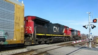 FAST CN AUTORACK TRAIN AT MONTREAL LEVEL CROSSING 3-12-20