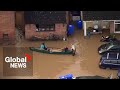 UK floods: Locals paddle through streets in southwest England