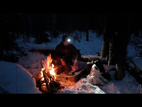 This can't be a coincidence. Spectators unpacking packages around a campfire