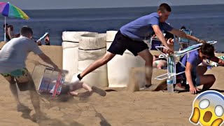 Chair pulling prank on public beach 😳 crazy reaction’s