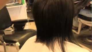 cutting women's long hair with clippers