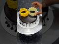 White and yellow color chocolate garnishing cake design decoration