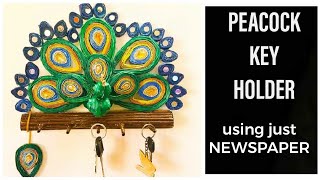 HOW TO MAKE NEWS PAPER WALL HANGING/DIY PEACOCK KEY HOLDER-DIWALI DECOR BEST OF WASTE.BEAUTIFUL KEY HOLDER IN THE FORM OF PEACOCK SITTING ON A FLUTE.ADD THIS BEAUTIFUL KEY