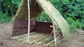 Grass thatch, mud hut with bamboo floor