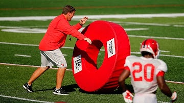 Rutgers coach Chris Ash uses giant tackling donuts to teach technique