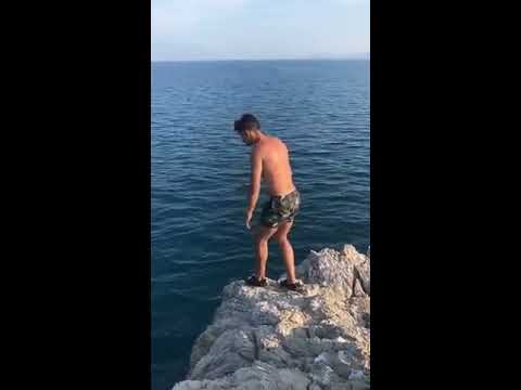 Drunk Guy Bellyflops After Trying To Frontflip Into Sea From Cliff 1058031