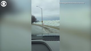 Strong winds blow Lake Erie ice over wall | 10News WTSP