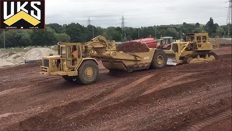 CATERPILLAR 631C/623E Scrapers Moving Mountains