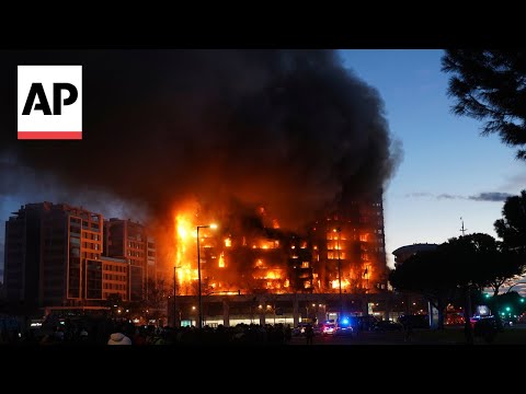Fire engulfs two buildings in Valencia, Spain