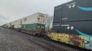 A northbound Norfolk Southern doublestack intermodal train with NS power.