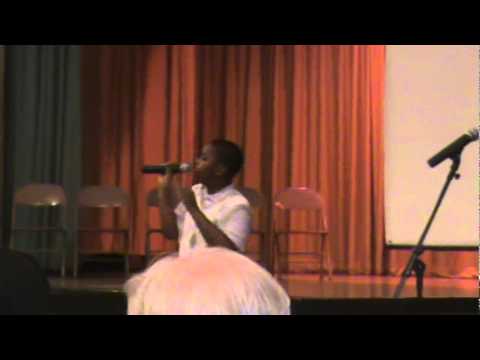 MIchael J Woodard singing at pollock elementary school