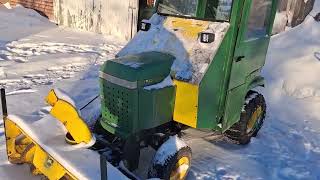 1983 John Deere 318 blowing snow