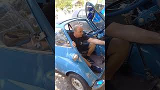 Man Opens Microcar’s, BMW Isetta, Refrigerator Door and Goes Inside