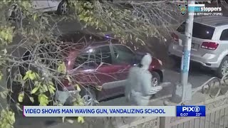 Video shows man waving gun, vandalizing school