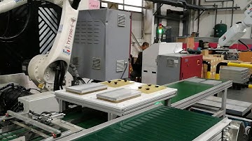 CNC material loading by 6 axis robot arm