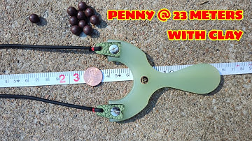 Penny at 23 meters with clay balls and a slingshot