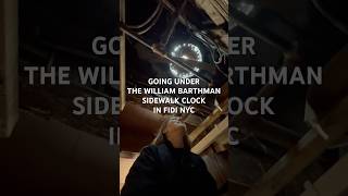 Going Under The William Barthman Sidewalk Clock in FiDi NYC