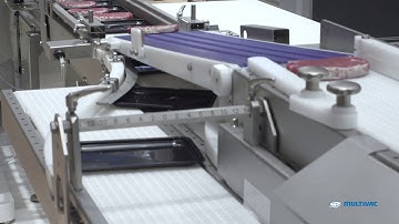 Automated traysealer line for portioning and packaging of fresh meat with full wrap labelling