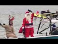 Santa and the Grinch waterski down the Potomac River Annual tradition in the Washington area spreads holiday cheer to local residents.