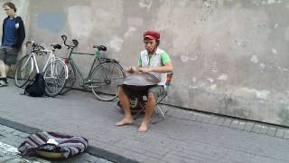 Man playing HANG DRUM in Vilnius Pilies street, LITHUANIA