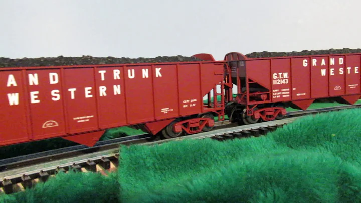 Grand Trunk Western Pacific steam locomotive and freight cars in O scale.