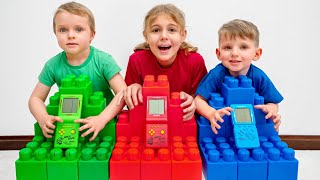 Vania Mania Kids play and build colored blocks for Big Tetris Game