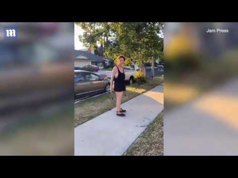 Video Racist woman attacks neighbors car with a hammer